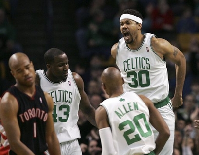 Boston Celtics' Rasheed Wallace (30) yells as he celebrates with teammates 