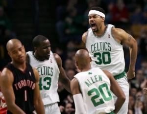 Boston Celtics' Rasheed Wallace (30) yells as he celebrates with teammates Kendrick Perkins (43) and Ray Allen after dunking the ball as Toronto Raptors' Jarrett Jack (1) looks on during the second half of an NBA basketball game Saturday, Jan. 2, 2010, in Boston. The Celtics beat the Raptors, 103-96. picture appears courtesy of ap/photo/ Mary Schwalm  ......