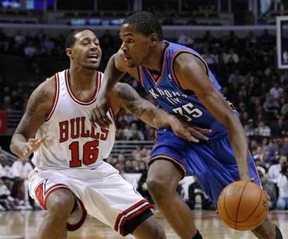 Oklahoma City Thunder forward Kevin Durant, right, drives on Chicago Bulls guard James Johnson during the first half of an NBA basketball game Monday, Jan. 4, 2010, in Chicago. picture appears courtesy of  ap/photo/ Charles Rex  Arbogast  .......